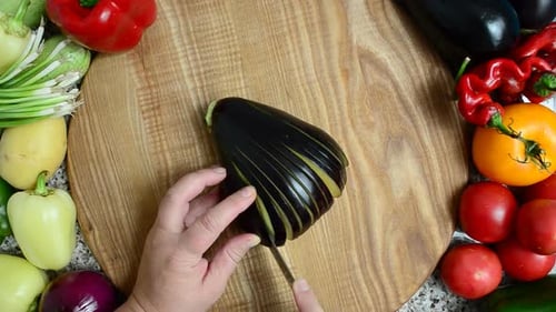 The Cook Cuts Eggplant