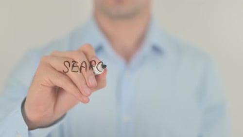 Search Engine Optimization, Man Writing on Transparent Screen