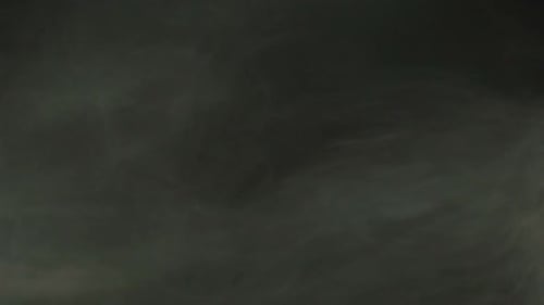 Abstract Smoke Patterns Against Dark Background