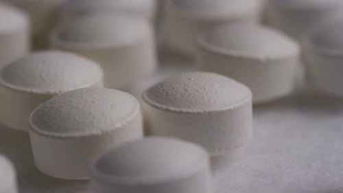 Close Up of Round White Medical Pills
