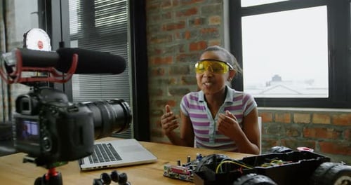 Girl Recording Technology Video in Workspace