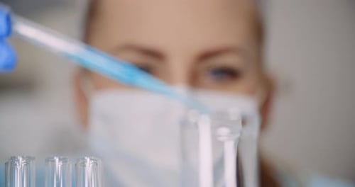 Scientist Conducts Medical Experiment in Laboratory