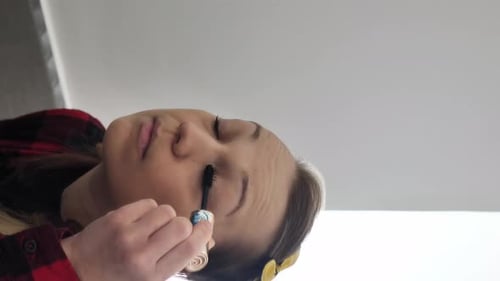 Young Adult Applying Mascara in Close Up Shot