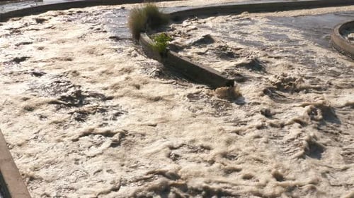Foamy Water Flows at Water Treatment Plant