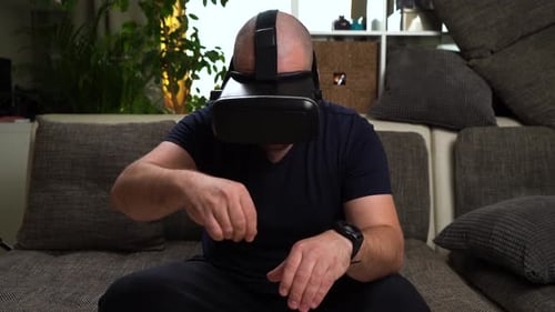 Adult Wearing VR Headset Interacting With Technology