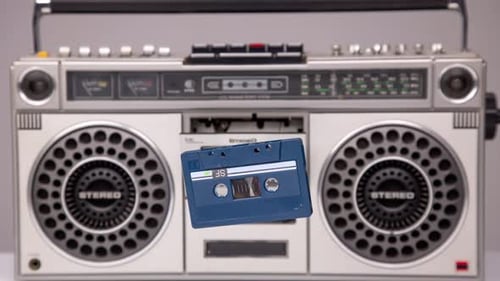 Cassette Tape Coming Out of Stereo Hifi
