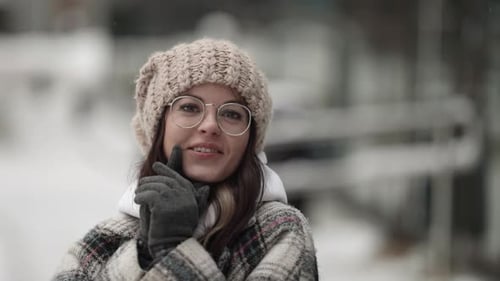 Portrait of Funny Young Townswoman at Winter in City Pretty Face Grimacing Looking at Camera