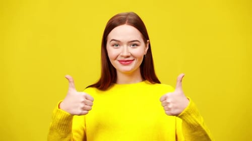 Smiling Woman Gives Thumbs Up Approval Gesture