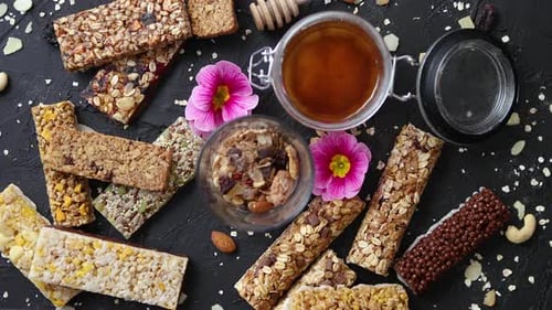 Assorted Granola Bars with Honey and Pink Flowers