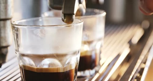 Close-up of espresso pouring from coffee machine