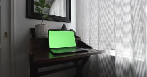 Home office in quiet and calm room with modern desk. Steadicam slowly pushes in to Close Up shot of