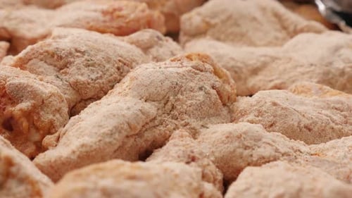 Close-up panning on buffalo wings spiced and rolled in dough 4K 2160p 30fps UltraHD footage - Raw ch