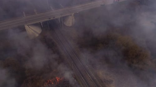 Rural Field Fire Burning near Highway Overpass