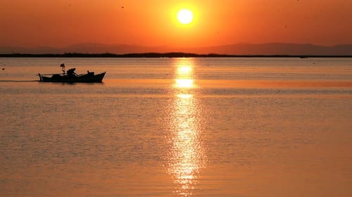 Sunset And Fishing Boat In Calm Sea 4