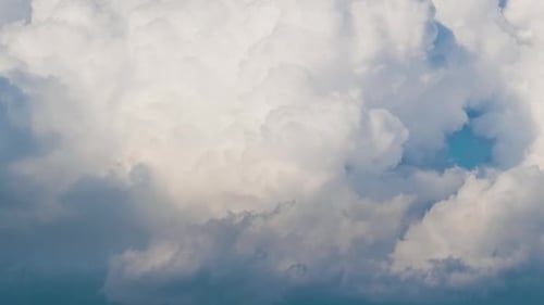 Timelapse of White Puffy Cumulus Clouds Forming on Summer Blue Sky