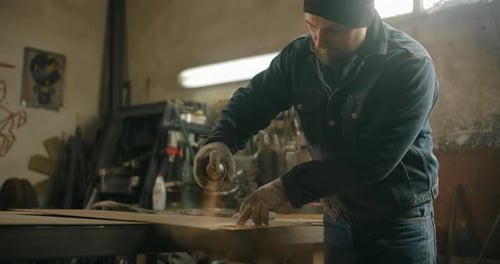 Locksmith Paints Metal Detail with Spray Can in Slow Motion Painting at Workshop with Stencil Spray