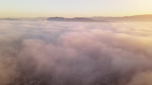 City Landscape Shrouded in Fog at Sunrise