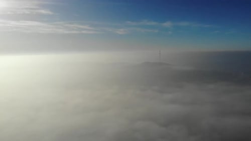 Flying over clouds. Video shot by drone in early morning.