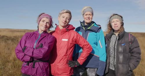 Four Women Standing Together in Rural Field