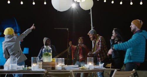 Friends Enjoy Live Music and Dancing at Night Party