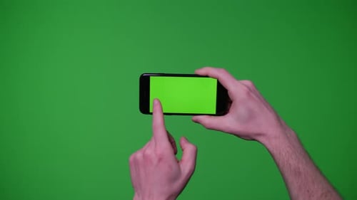 Hands Interacting with Smartphone on Green Screen