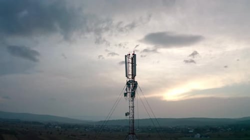 Aerial Drone View. Communication Transmitter Tower in the Countryside. Midel Shot