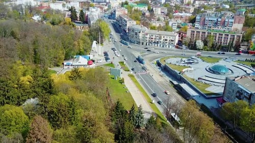 Aerial view of the city center. Aerial city view with crossroads, roads, houses, buildings, parks