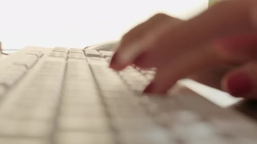 Close Up Shot of Woman Hand Typing on the Computer Keyboard in the Modern Office at the Table.