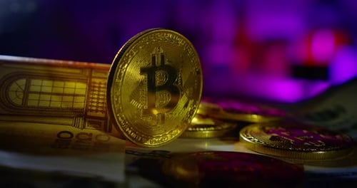 the Bitcoin Coin Rotates, Along with Other Money. Close Up