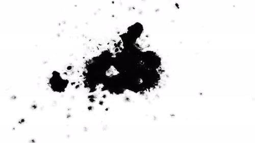 Abstract Black Inkblot Spreads Across White Background
