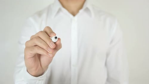 Man Writes Time on Transparent Surface With Marker