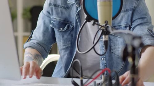 Male Singer Recording New Song in Home Studio