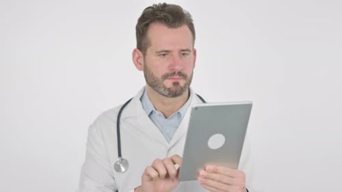Male Doctor Using Tablet for Patient Information