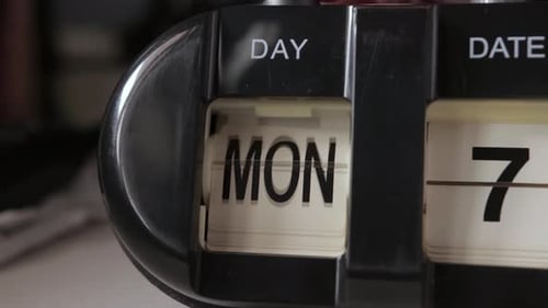 Retro Mechanical Black Flip Desk Clock, Manually Changing Days Close up, 4K
