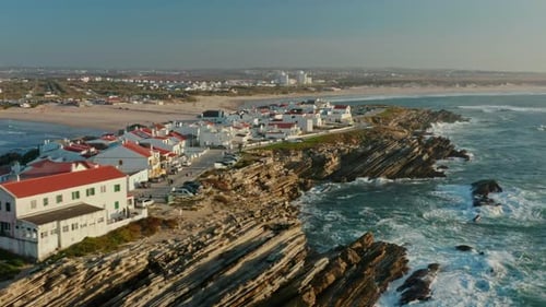 Aerial Footage of Rocky Formation with Waterscape in the Background