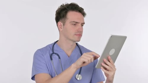 Young Adult Doctor Using Tablet in Hospital Setting