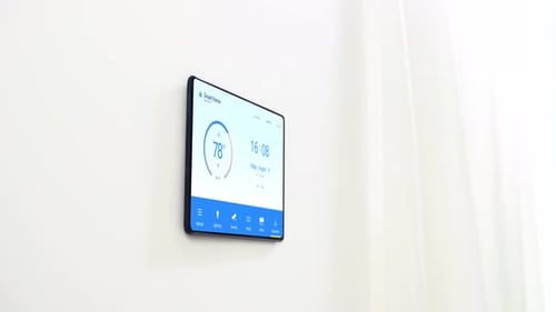 Woman Approaches Smart Home Automation Screen on Wall