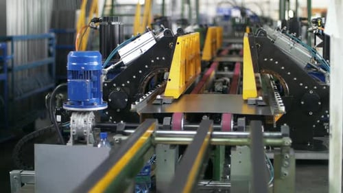 Steel Sheet Moving on Automated Conveyor Line. Manufacturing Domestic Appliances