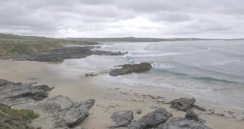 Cornwall seaside view with waves and cliffs