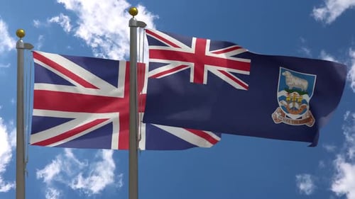 Waving United Kingdom and Falkland Islands Flags in a Clear Blue Sky
