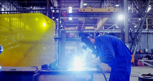 Male Engineer Using Welding Torch
