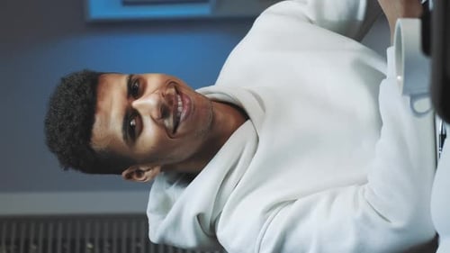 Smiling Young Man in White Hoodie Close Up