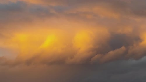 Time Lapse of Fast Moving Stormy Clouds on Dark Yellow Sky at Sunset