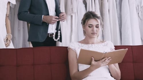 Engaged Couple Share Loving Moment in Bridal Shop