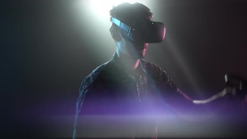 Man Immersed in Virtual Reality Headset Experience