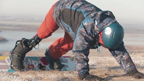 Man with Prosthetic Leg Standing Up From the Ground