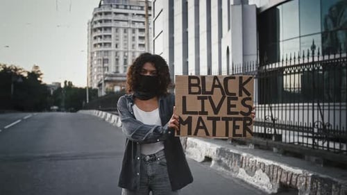 Young Adult Holding Black Lives Matter Sign
