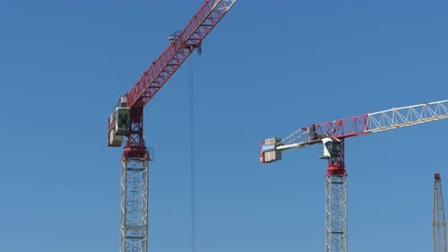 Construction Crane is Working on a Construction Site