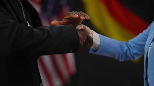 Handshake Between Two People in Suits
