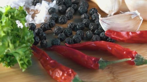 Fresh Spices Displayed on a Wooden Cutting Board